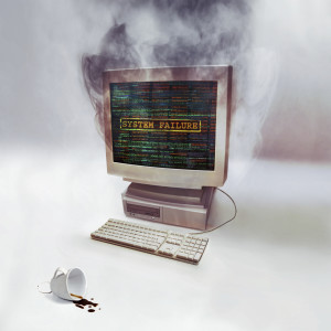 Shot of a desktop computer smoking after burning out to suggest need for a backup-disaster recovery plan. All screen content is designed by us and not copyrighted by others, and upon purchase a user license is granted to the purchaser. A property release can be obtained if needed.